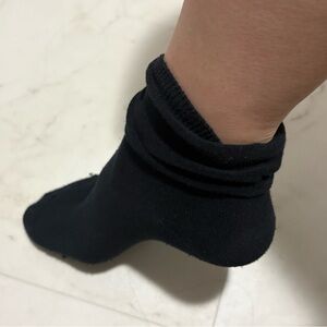 Black socks thin can be worn up or down. Old worn and smelly